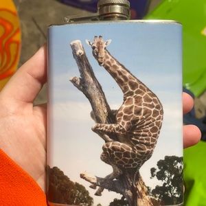 Giraffe hugging tree flask